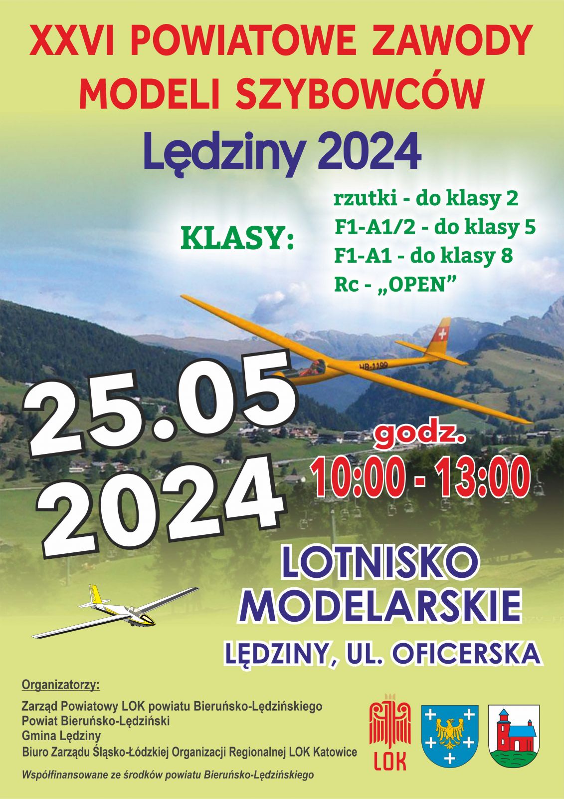 Plakat informacyjnu z szybowcem na tle gór